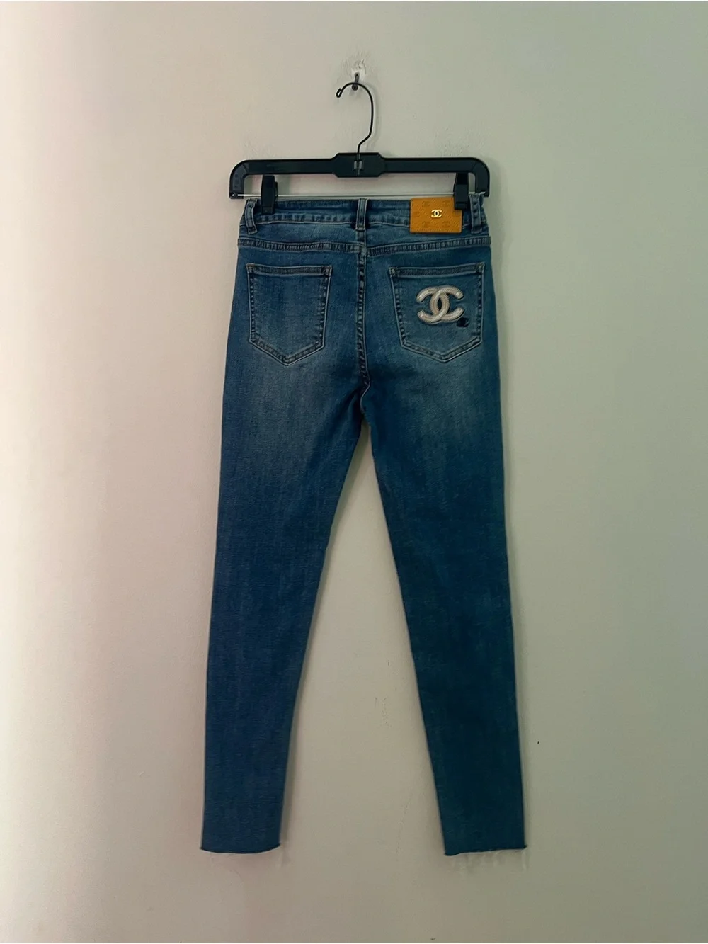 CHANEL Women's Blue Skinny Jeans with Gold-Tone Studs